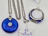 three pieces of jewelry including a necklace, ring, and a ring