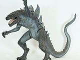 a godzilla figure that is standing on a white surface