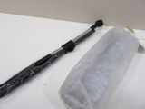 a black umbrella sitting on a table next to a roll of plastic