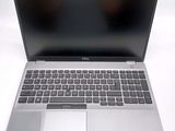 an open laptop computer sitting on top of a white table
