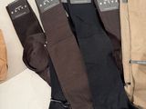 several pairs of men ' s socks are lined up on a table