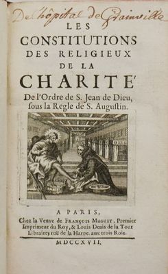 un vieux livre sur lequel figure l'image d'un homme et d'une femme assis sur une chaise