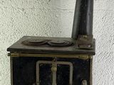 a black stove sitting on a white table