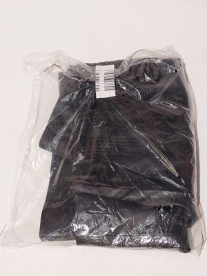 a bag of black clothing on a white surface