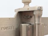 a close up of a metal object on a white surface