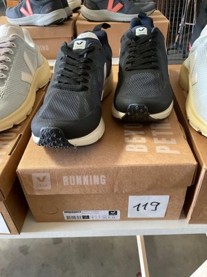 several pairs of running shoes are on display in a store