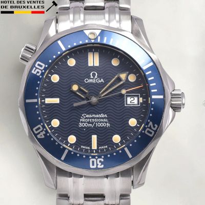 a close up of a watch with a blue face