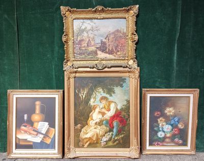 three framed pictures of a couple of paintings on a table