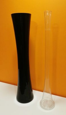 two vases that are sitting on a table