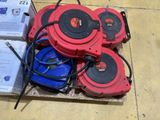 a pile of red and black hoses on the floor