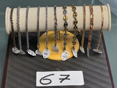 a display case with many different types of necklaces on it