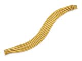 a gold bracelet with a curved design on a white background