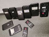 several cell phones are lined up on the floor next to each other