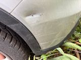 a close up of a car tire with a hole in it
