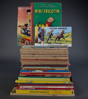 several children ' s books stacked on top of each other on a table