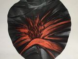 an image of a black and red flower on a white background
