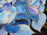 a picture of a vase with blue flowers on it