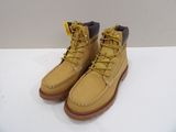 yellow boots with yellow laces on them sitting on a white surface