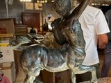 a statue of a man riding a horse in a museum