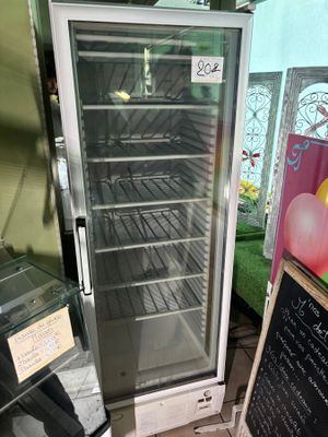 an image of a glass door refrigerator in a store