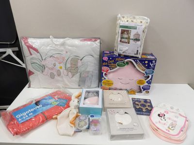 a lot of baby items on a table in the room