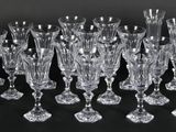 a close up of a bunch of wine glasses on a table