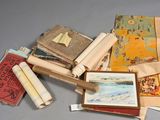 a pile of old books and papers on a table