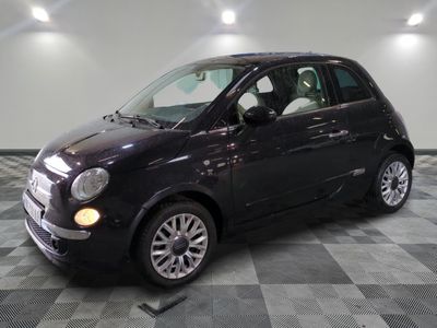 a picture of a small black car on a checkered floor
