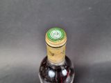 a bottle of wine that is sitting on a table