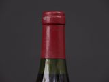 a bottle of wine that is sitting on a table
