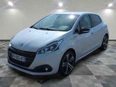 a white car parked in a room with a checkered floor