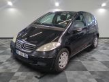 a picture of a small black car parked on a checkered floor
