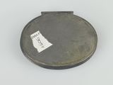 a small metal object with a sticker on it