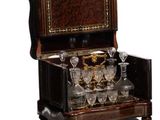 a wooden box with a wine glass set inside of it