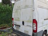 a white van that is parked on the side of the road