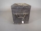 a small metal box with a tag attached to it