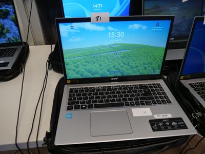 three laptops that are sitting on a desk