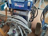 a machine that is sitting on the floor next to some tools