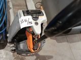 a sign on the side of a machine that is on the ground