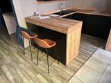 two chairs sitting at the bar in the kitchen