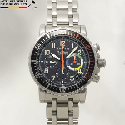 a close up of a watch on a metal bracelet