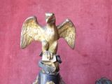 a statue of an eagle on top of a pedestal
