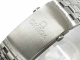 a close up of a watch on a white surface