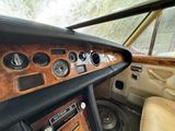 a dashboard of a car with a clock and other items in it