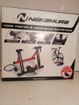 a box with a bike trainer and a bicycle on it