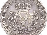a close up of a coin with a crown on top of it