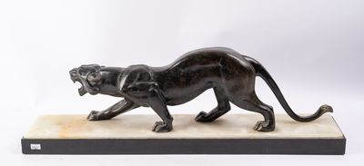 a bronze statue of a panther on a marble base