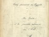 un vieux livre écrit posé sur une table