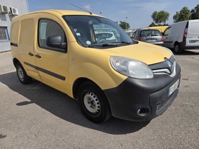 the yellow van is parked in a parking lot with other cars