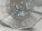a clear glass vase with a clear top on a table